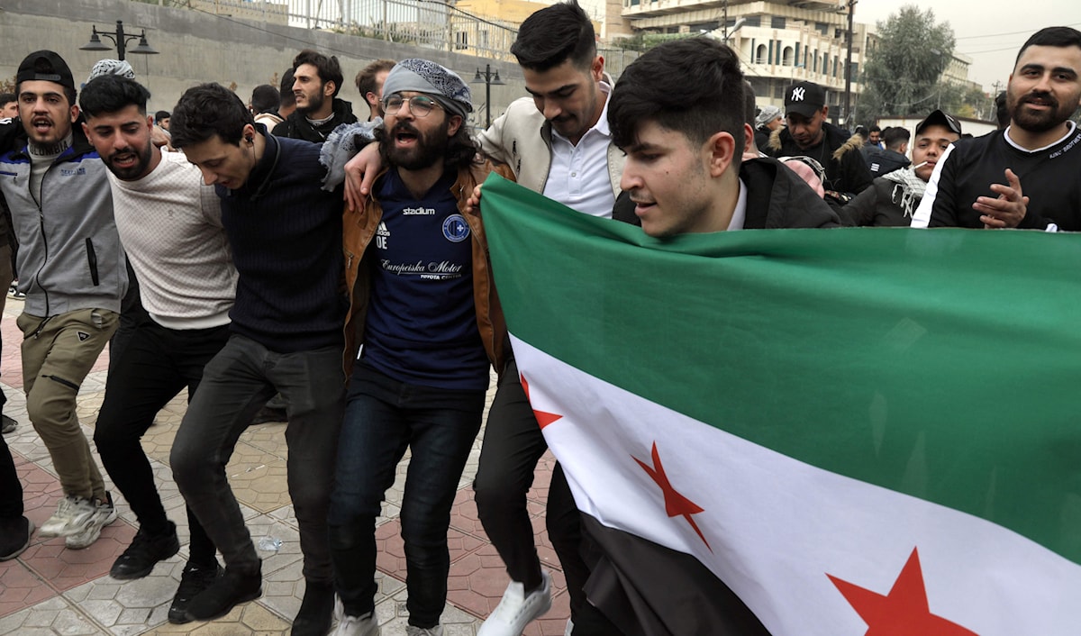 احتفال في أربيل بسقوط الأسد (أ ف ب)