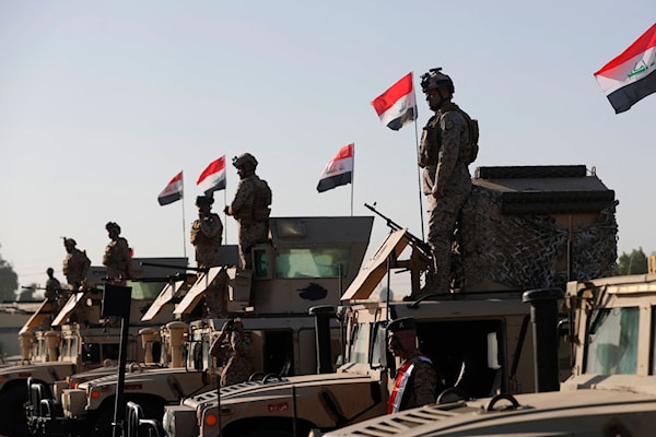 تدريبات عسكرية عراقية بمشاركة فرنسية في قاعدة التاجي شمال بغداد (أ ف ب)