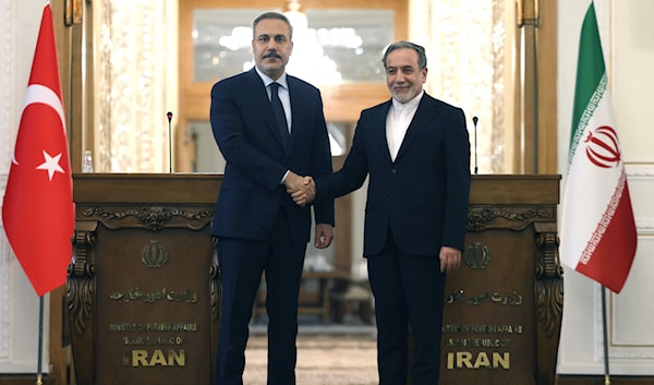 أكّد فيدان أن بلاده «تقف إلى جانب إيران في المفاوضات النووية» (أ ف ب)