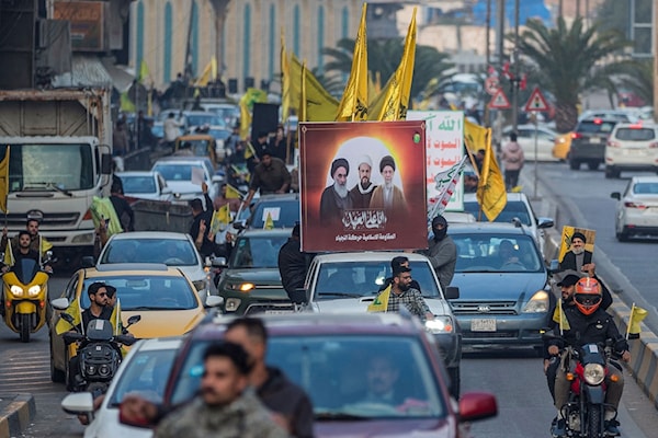 مسيرة مؤيدة لحزب الله في بغداد (أ ف ب)