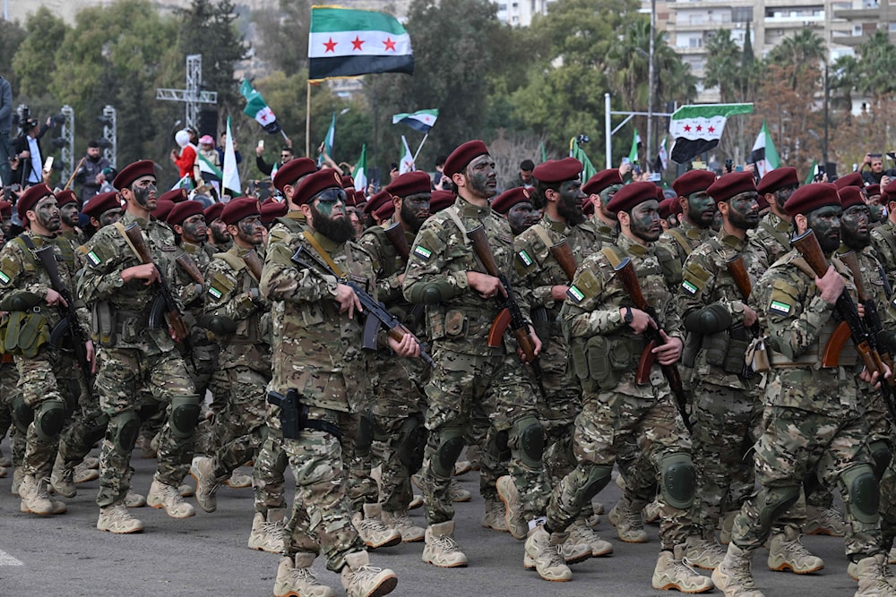 انتقد شربجي العرض العسكري في ذكرى سقوط الأسد (أ ف ب)