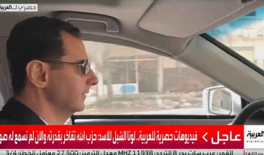 لقطات للأسد وهو يقود سيارته وإلى جانبه الشبل