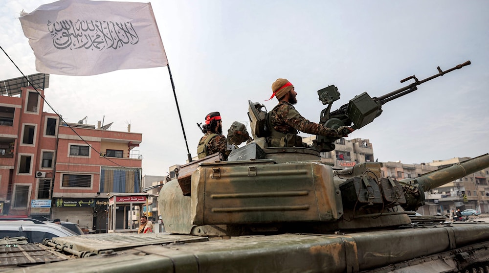 عناصر من هيئة «تحرير الشام» (أ ف ب)