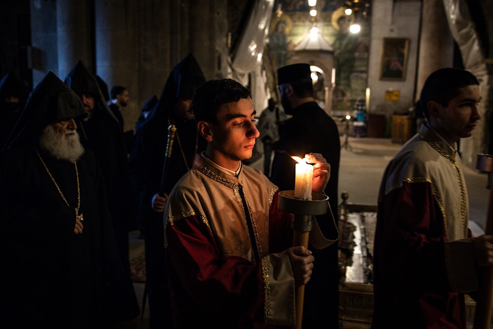 أقيمت قداديس وصلوات &laquo;الشعانين&raquo; في كنيسة القيامة بحضور عدد محدود من المصلين (أ ف ب)