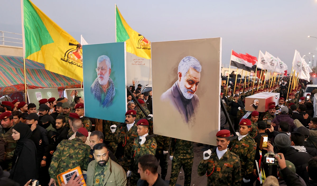 استعراض لـ "الحشد الشعبي" في بغداد في ذكرى استشهاد سليماني والمهندس (أ ف ب)