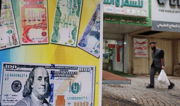 خفض قيمة الدينار يحدث فوضى في الأسواق العراقية (أ ف ب)