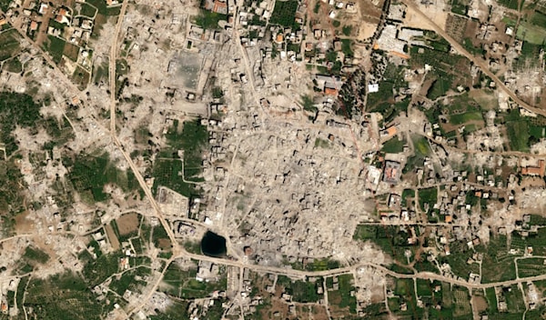 صورة جوية لمدينة بنت جبيل تظهر مسح العدو لأحياء بأكملها عن وجه الأرض (on geo satellite)